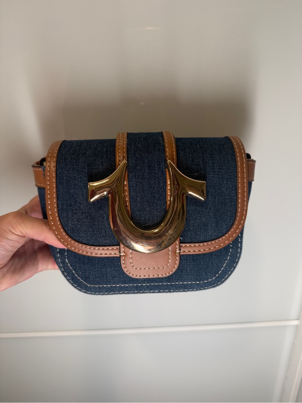 True Religion Denim Crossbody with Tan Trim and Gold Horseshoe